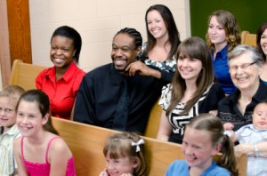 Universal Church, families sitting in church, diversity