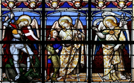 stained glass window of three archangels Michael, Raphael, and Gabriel