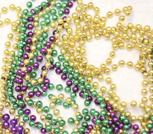 Photo of beads in traditional Mardi Gras Colors