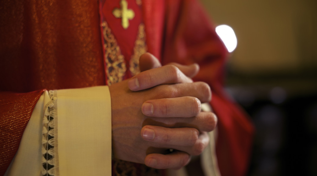 Catholic priest in robes