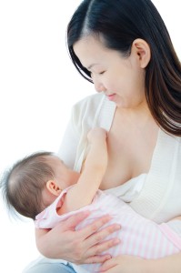 A young mother Breastfeeding her baby