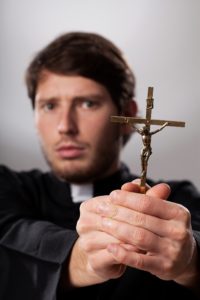 Catholic Priest Performing an Exorcism