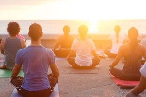 Several people in a yoga class.