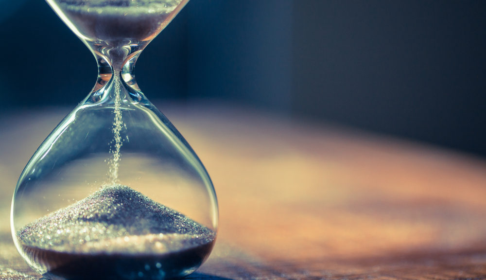 An hourglass marks the passage of time.