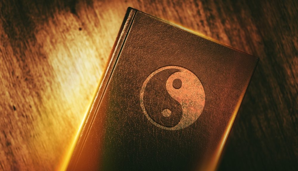 The photo shows a book for understanding Taoism with the yin and yang symbol on the front.