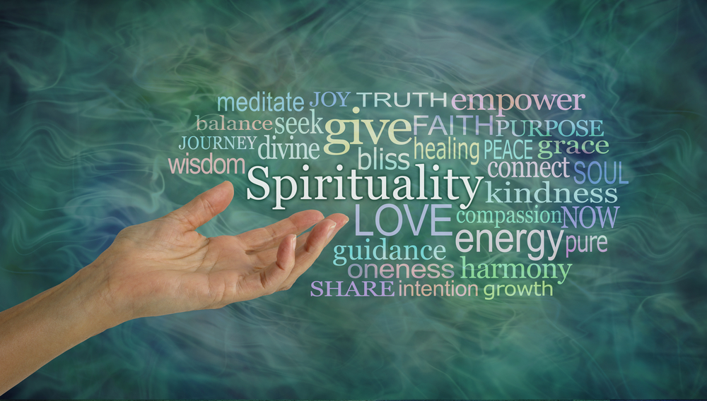 An outstretched hand gestures at a word cloud associated with spiritual advice.