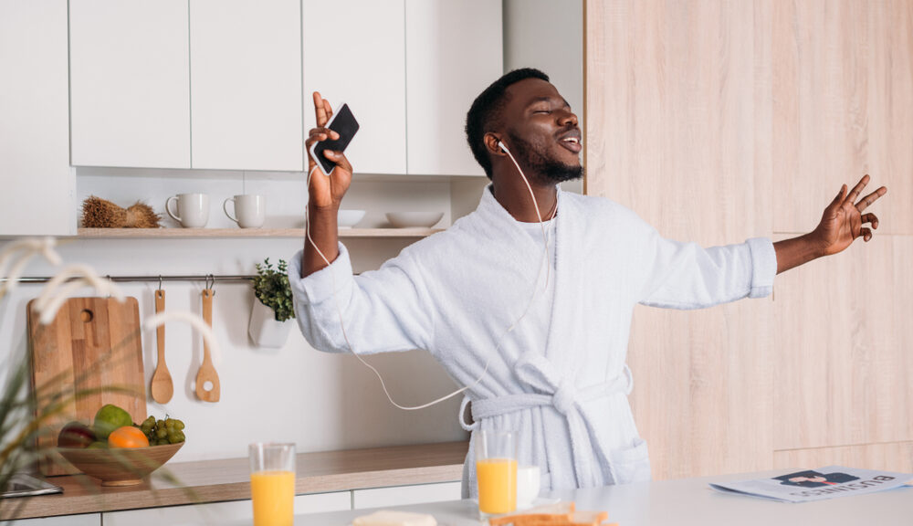 A man dances with his iPod to cope with stress.