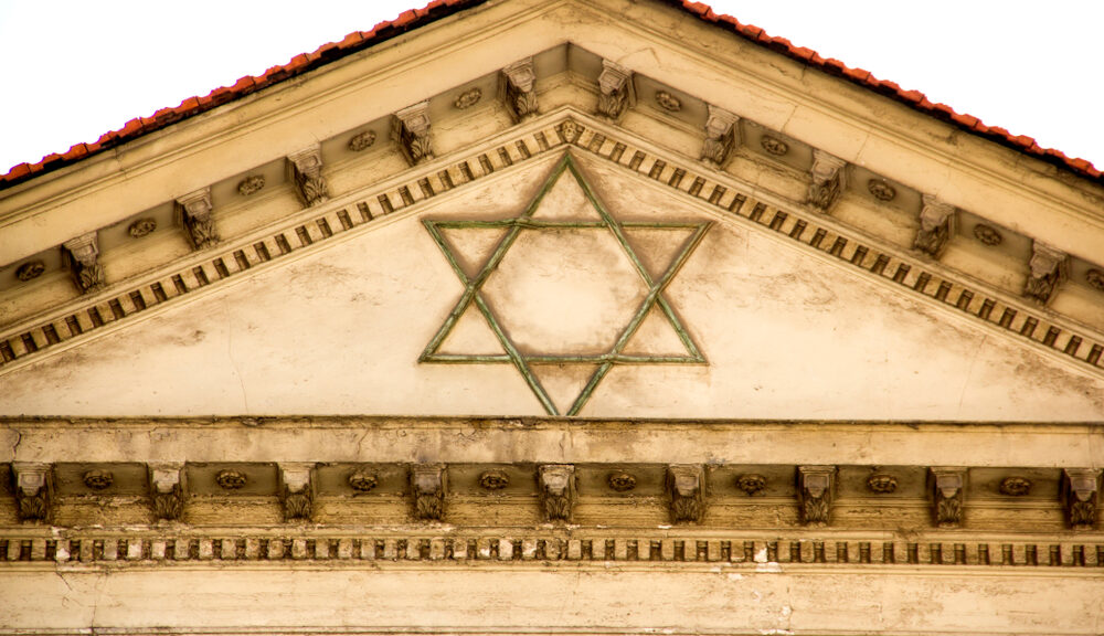 A Jewish star decorates the top of a building.
