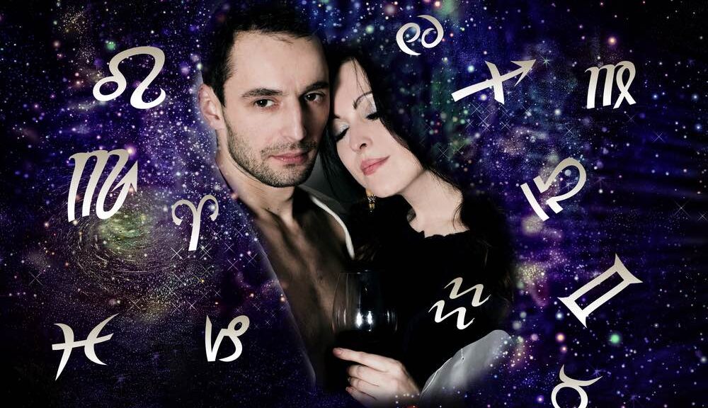 couple in love surrounded by zodiac signs