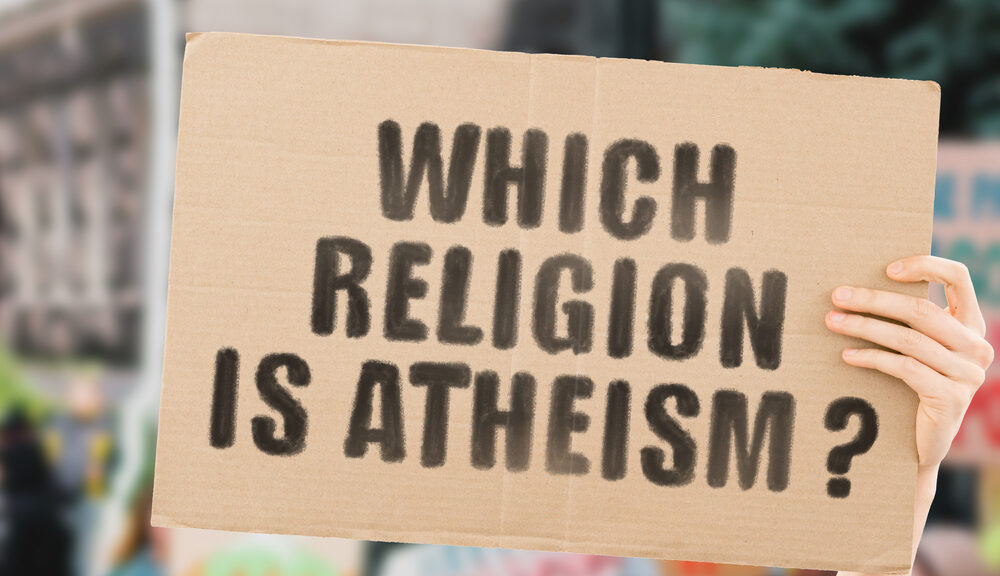 A sign asking "which religion is atheism?"