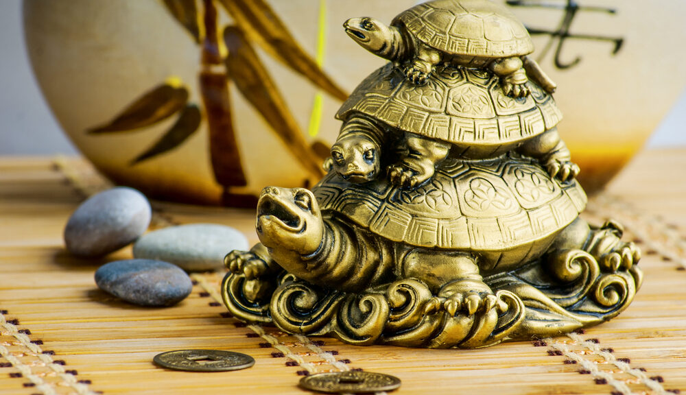 A metal turtle contributes to the feng shui of the room.