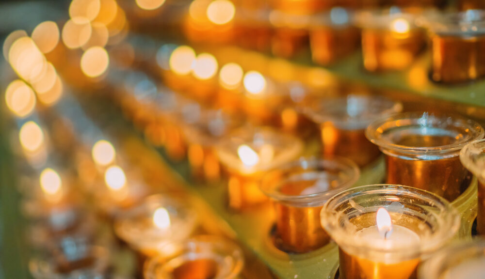 small candles in rows on alter for faith ceremony