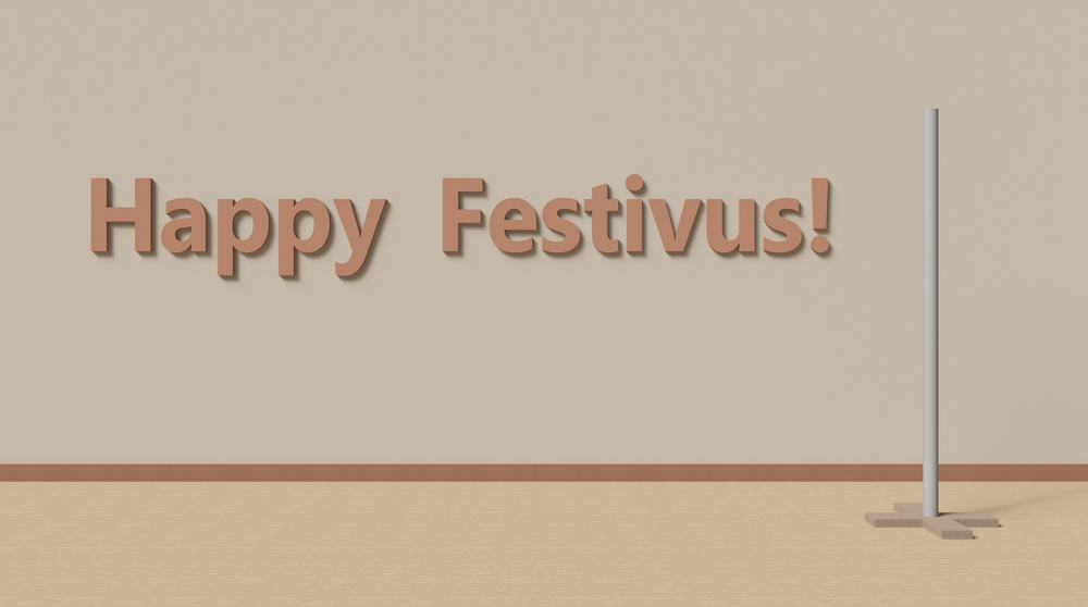 An image of a blank room with the words "Happy Festivus" and a metal pole.