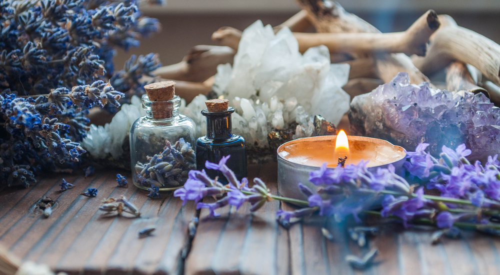 A table full of incense and one candle.