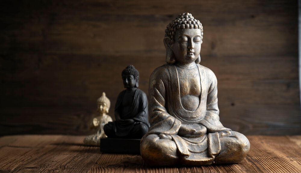 A stone figurine of the Buddha.