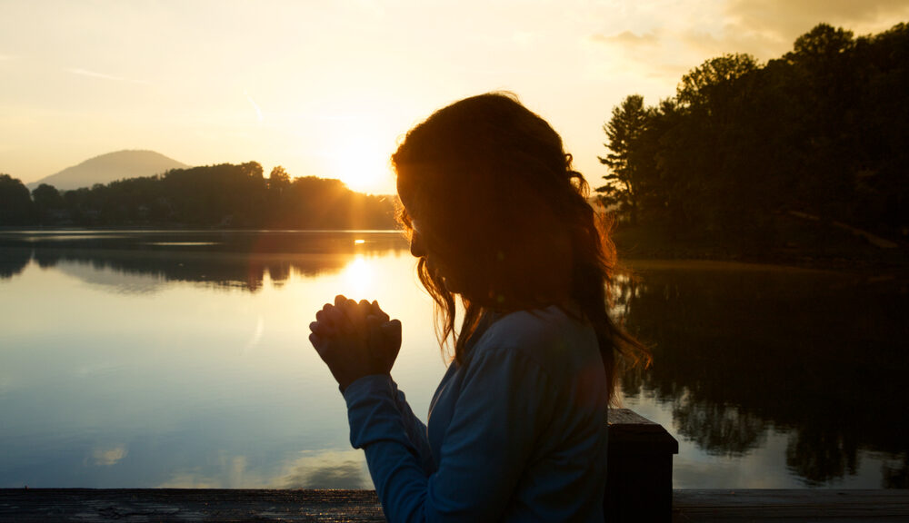 woman meditating and healing in nature